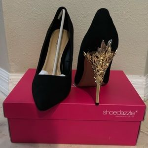 Black pumps with metal gold heels